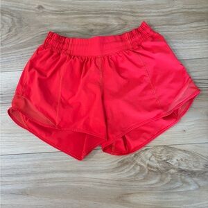 Lululemon carnation red 4 inch inseam mid rise shorts